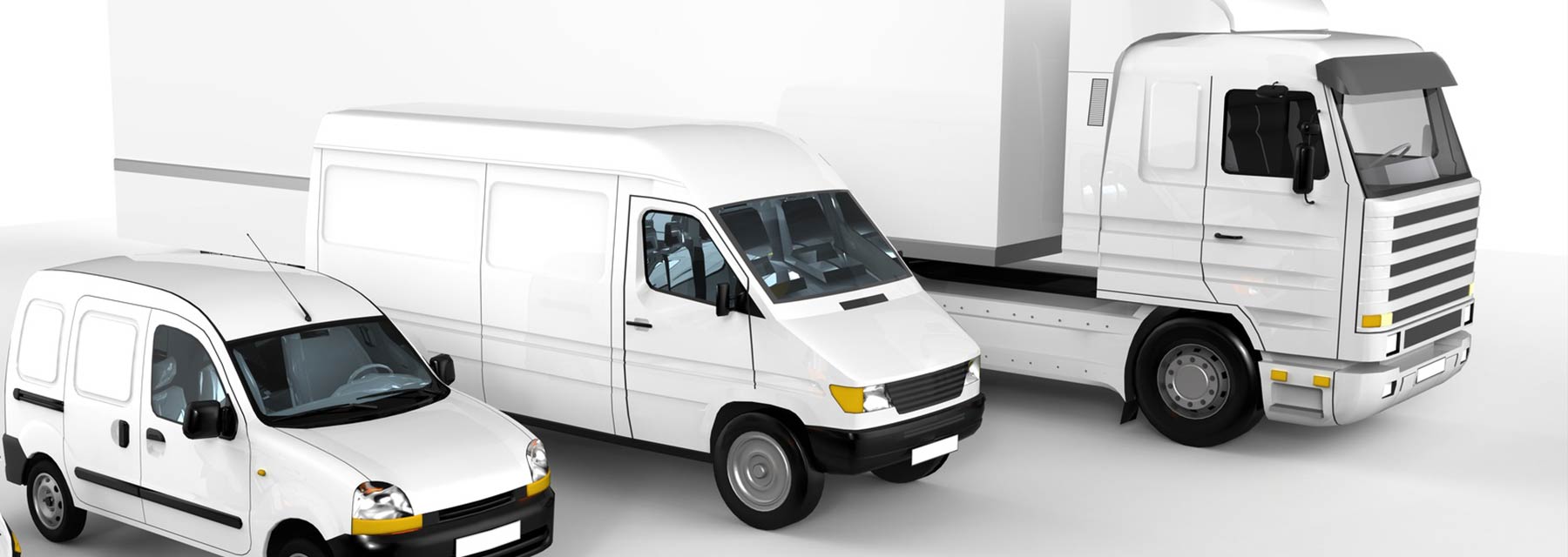 3 white commercial vehicles parked